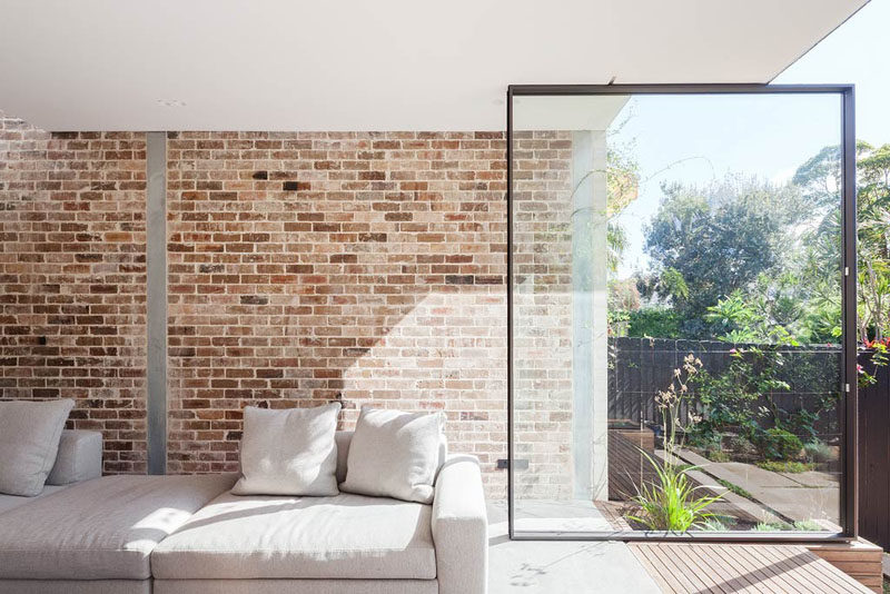 The Back Wall Of This Home Is Made From Two Large Pivoting Glass Doors 2