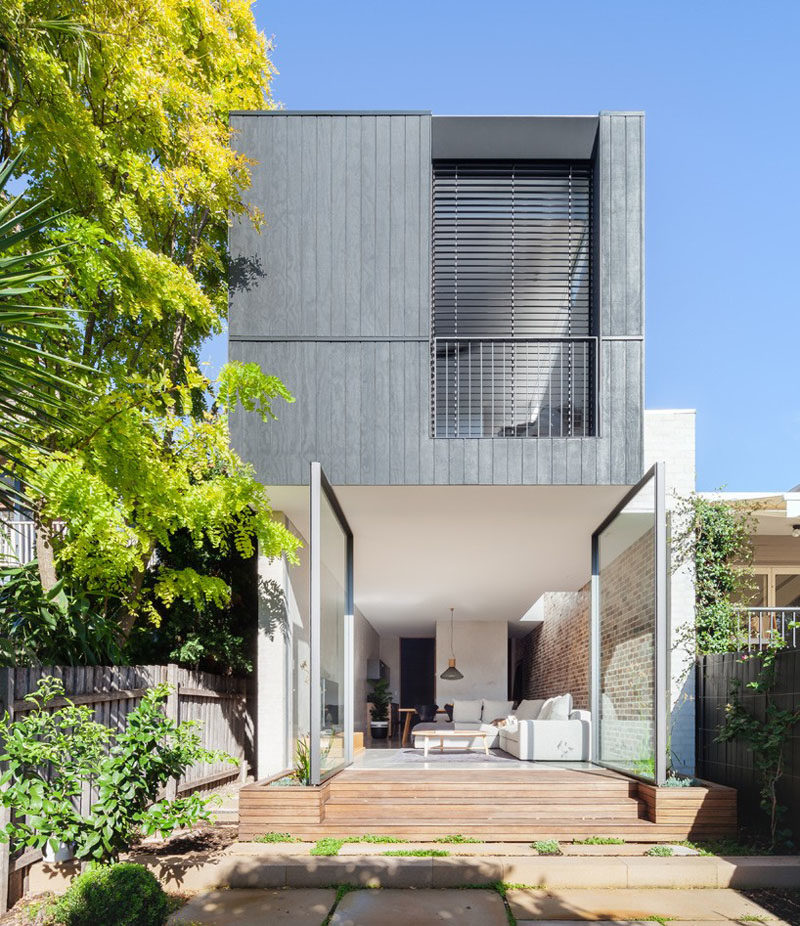 The Back Wall Of This Home Is Made From Two Large Pivoting Glass Doors 3