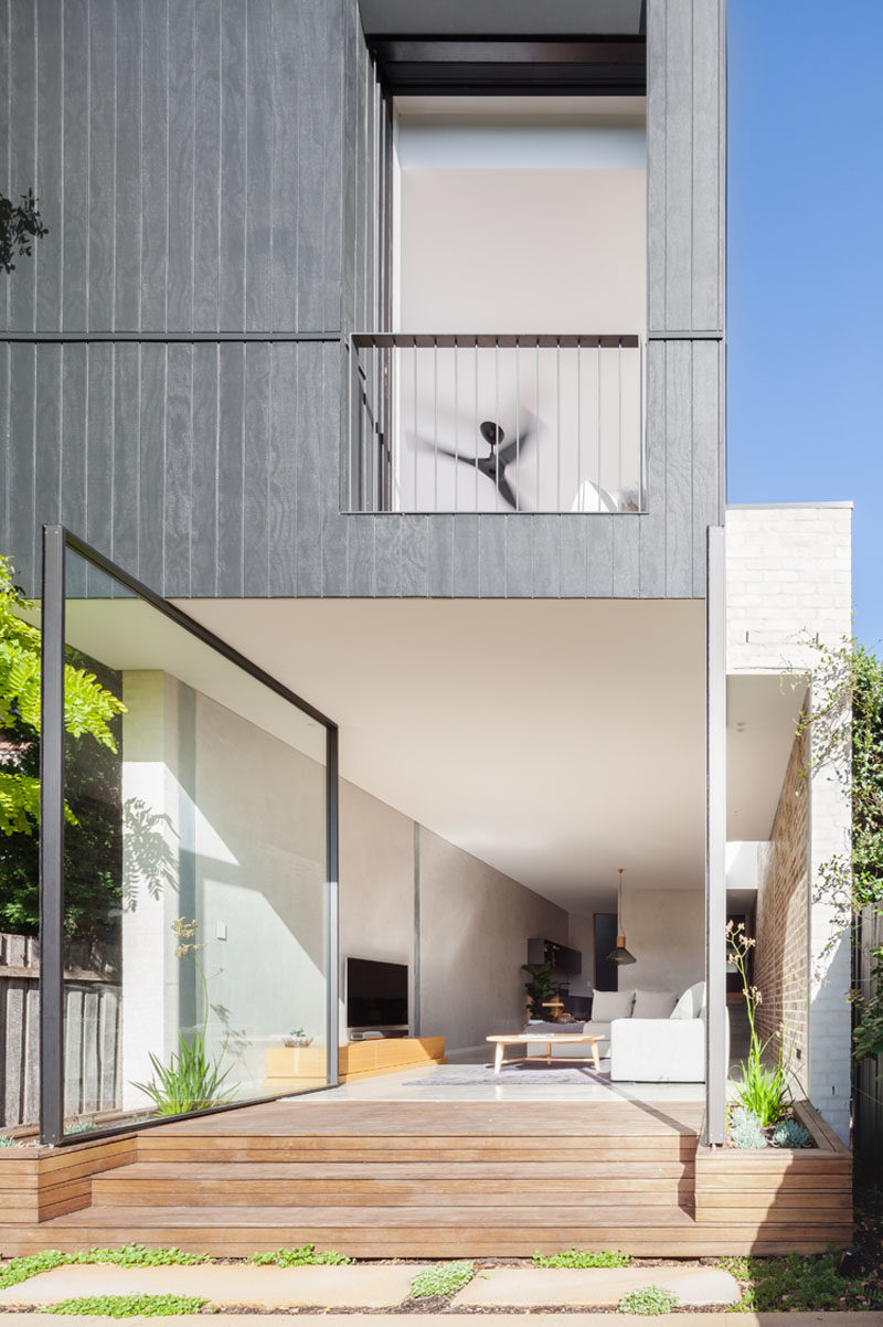 The Back Wall Of This Home Is Made From Two Large Pivoting Glass Doors 5