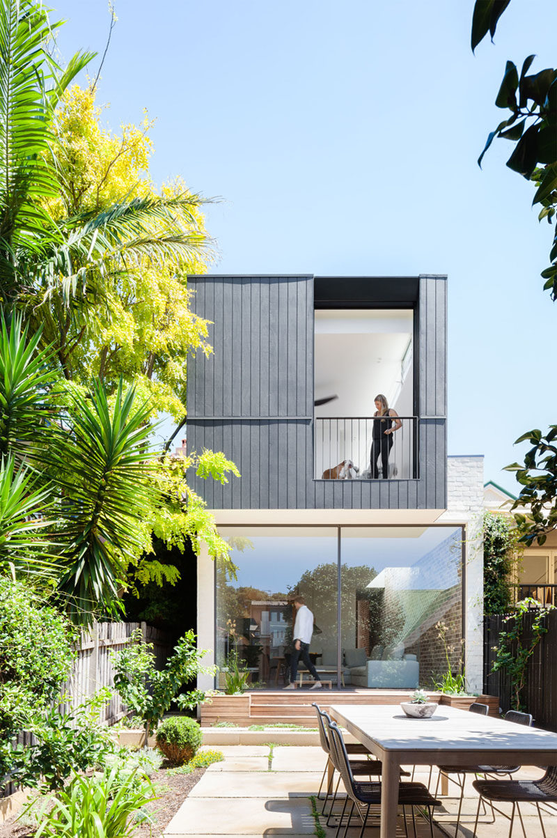 The Back Wall Of This Home Is Made From Two Large Pivoting Glass Doors 6